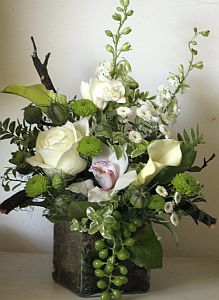 Wedding gift flowers arrangement made of  white calla-lily, cymbidium orchid, freesia, santini, etc.